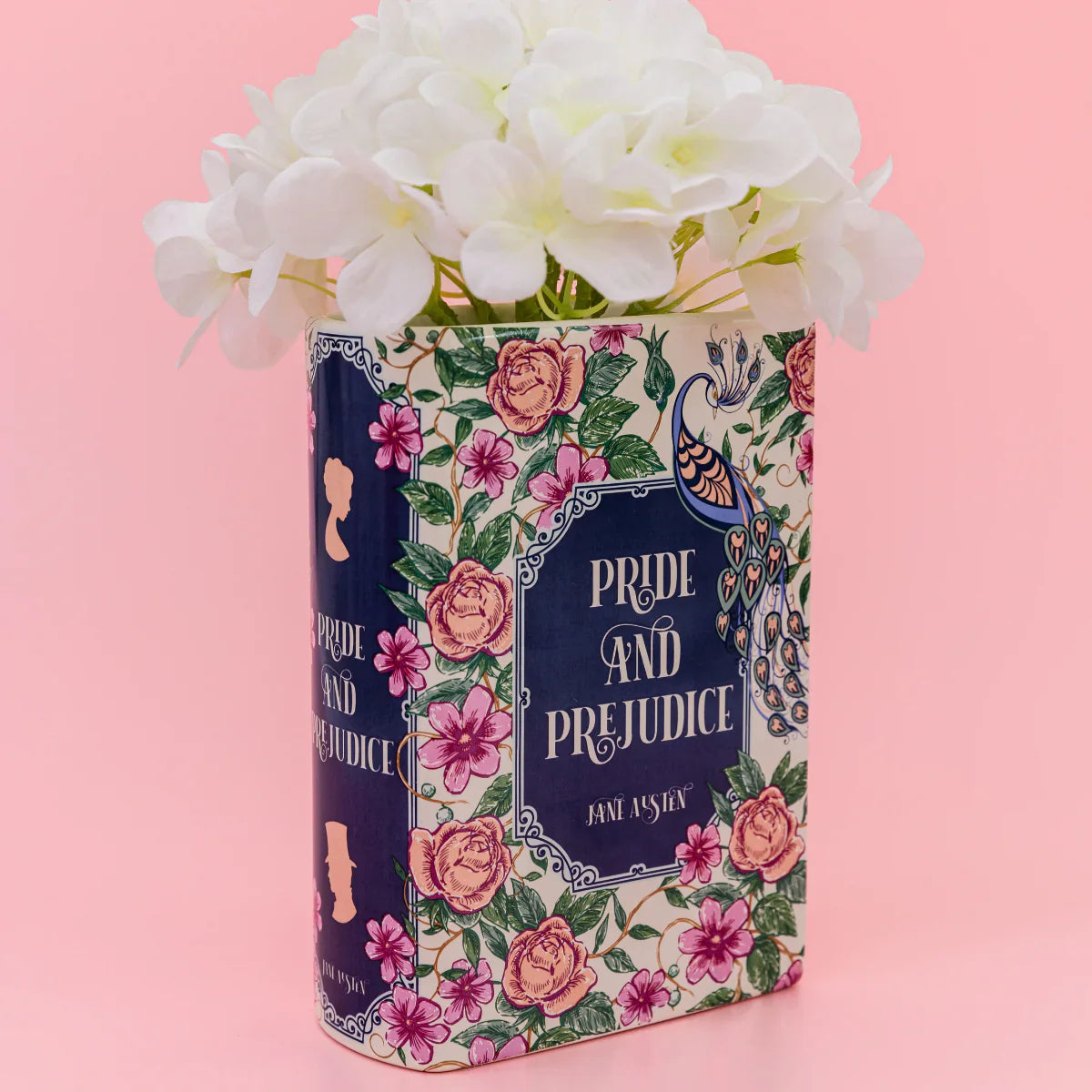 Pride and Prejudice book shaped vase filled with white flowers