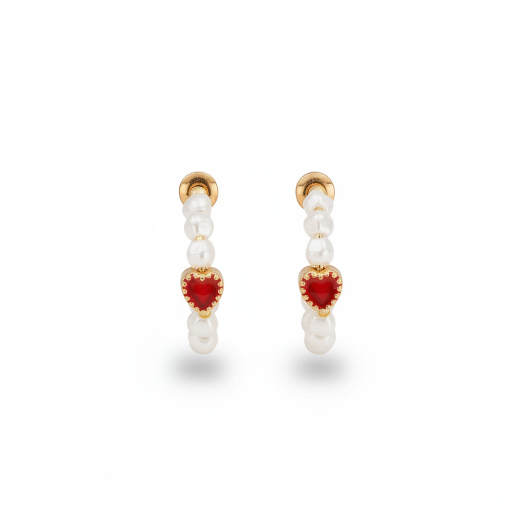 Fable England pearl hoop earrings with a red enamel heart charm in worn gold