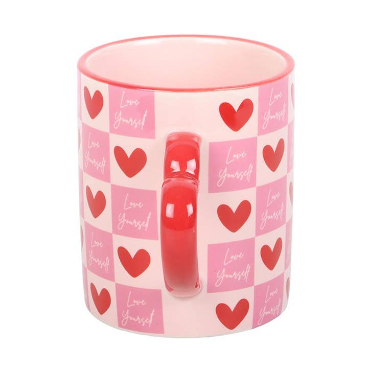 Heart pattern mug showing reverse side with red handle