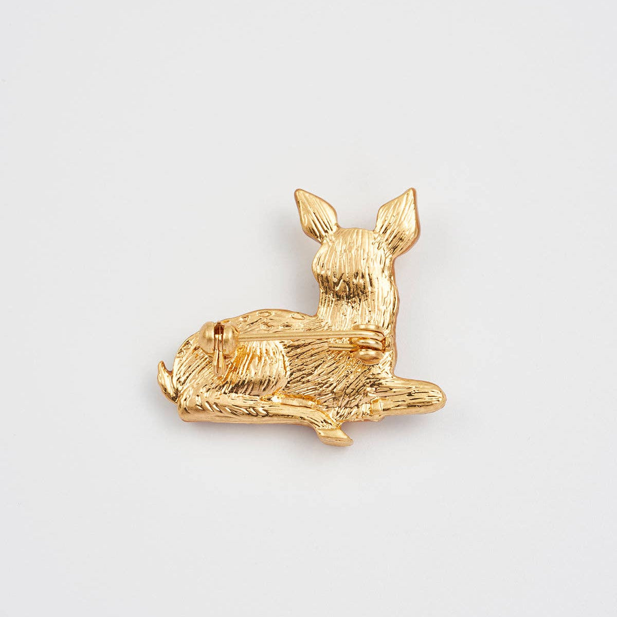 Front view of Resting Fawn Brooch on white background