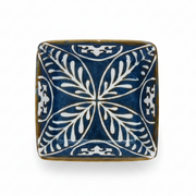 Blue square ceramic dipping bowl, side angle on white background.