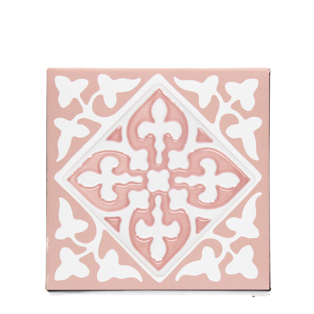 Single pink embossed tile coaster with ornate white pattern.