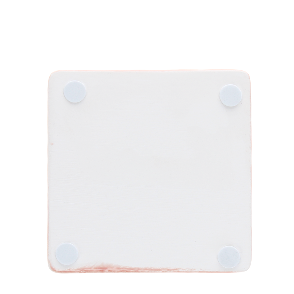 Reverse of pink tile coaster showing four corner foam pads.
