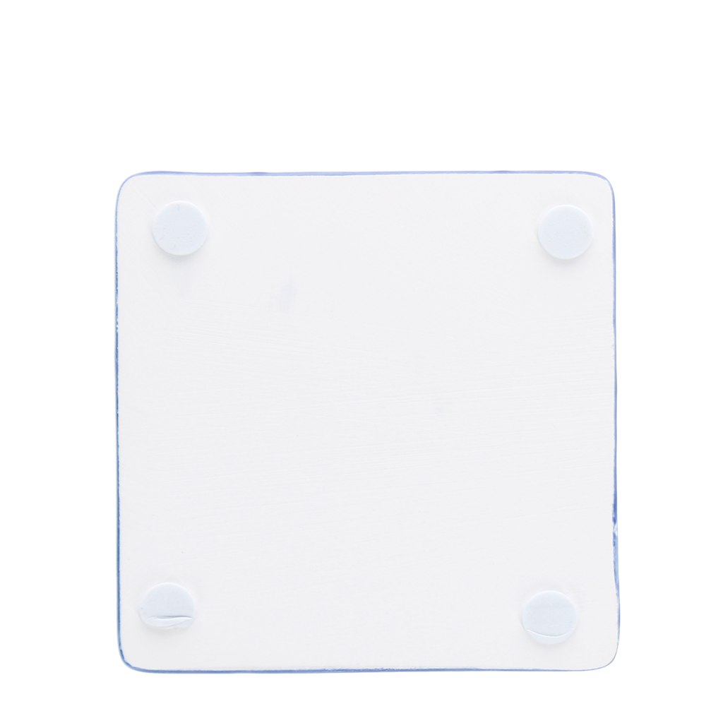 Reverse of navy tile coaster showing four corner foam pads.