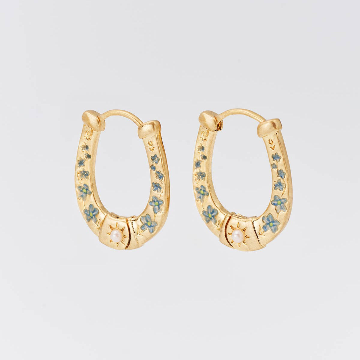 Pair of horseshoe hoops shown side by side on a plain background