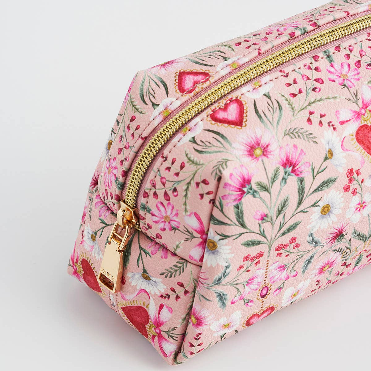 Interior lining of the pink faux leather pouch