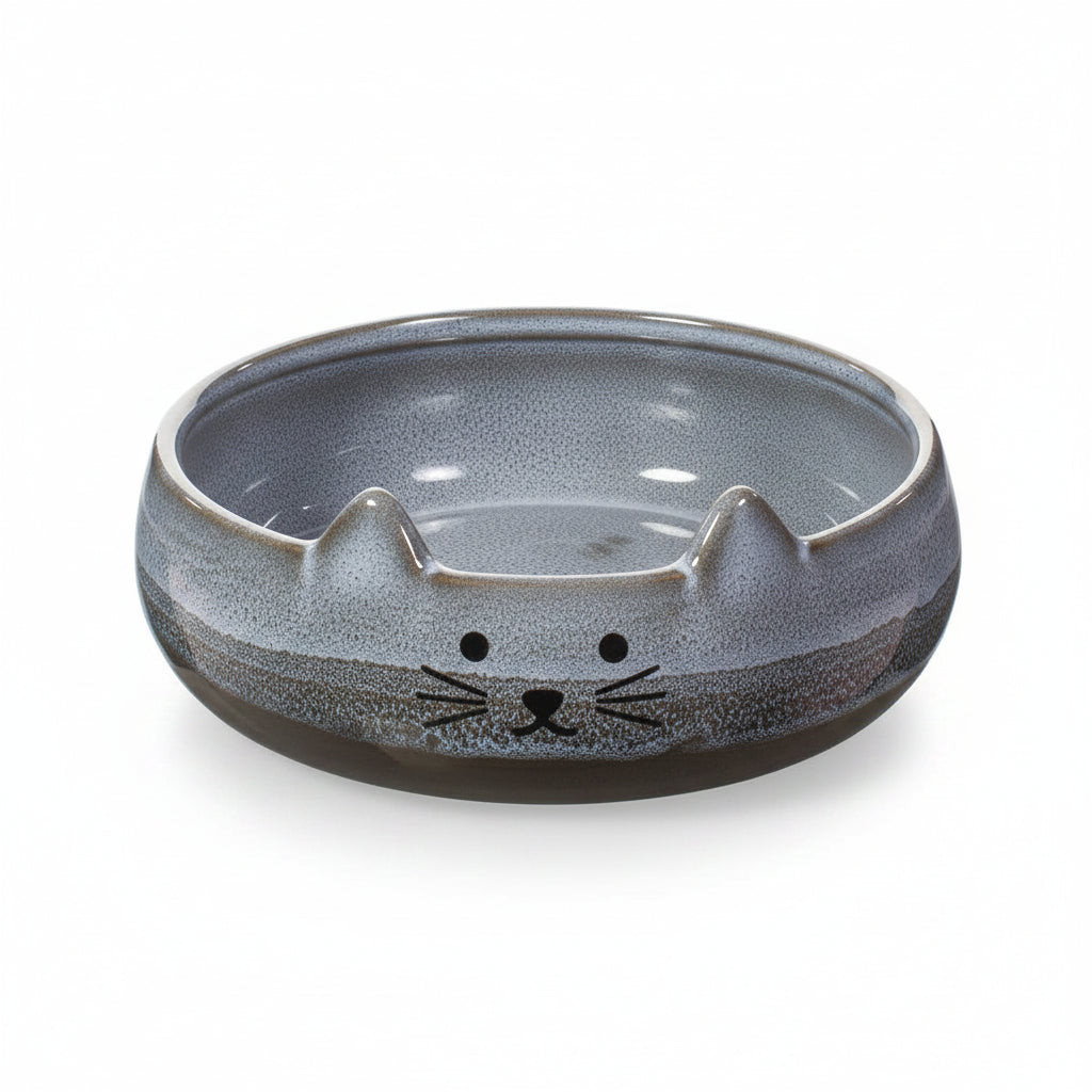 Top view of grey Mojave cat pet bowl with whiskers and pointed ears design on white background