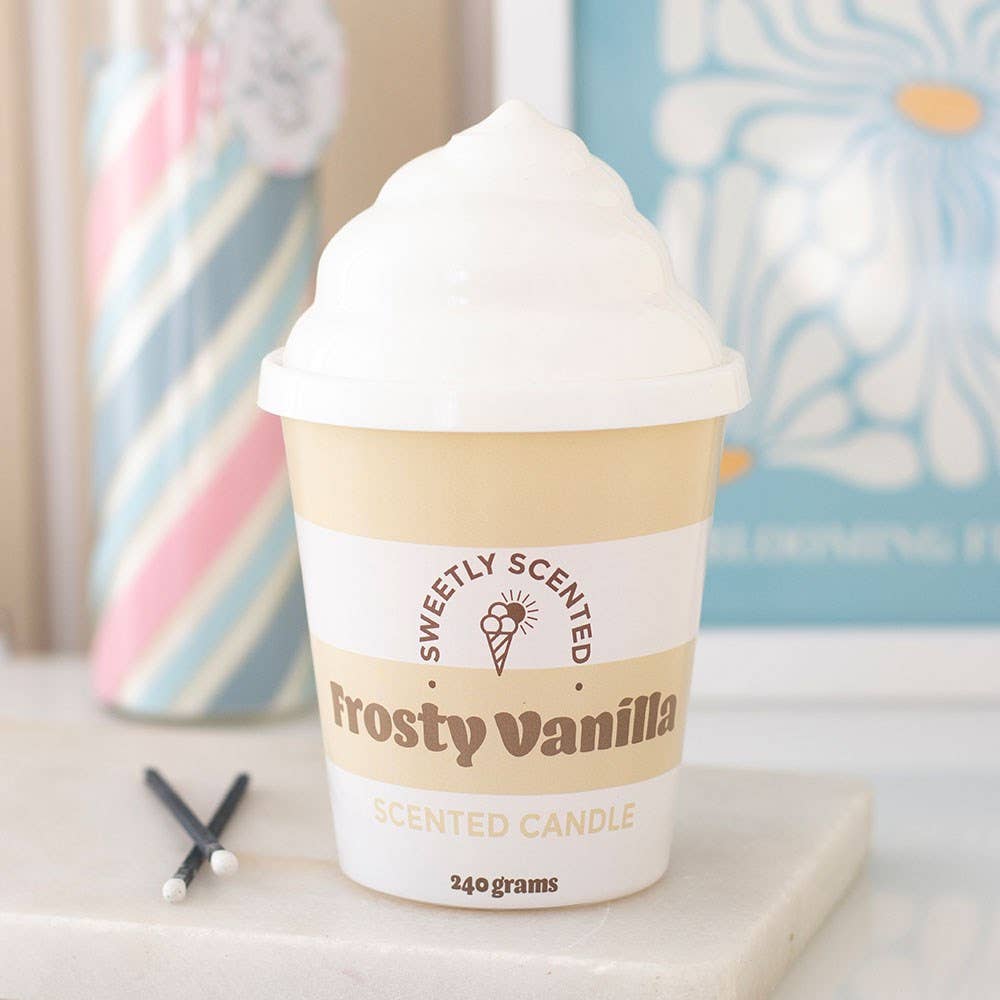 Frosty Vanilla ice cream candle styled on marble with candy stick