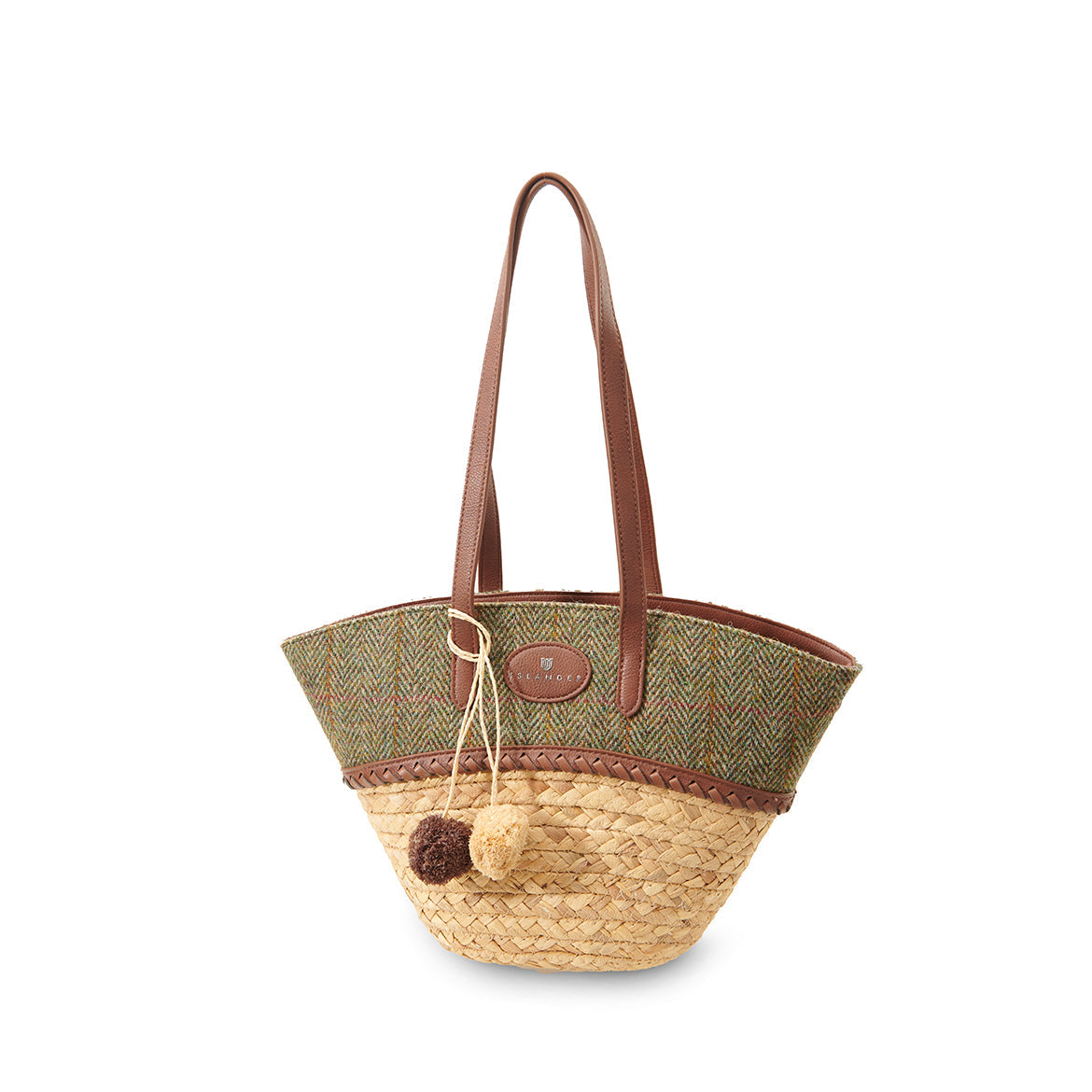 Woven straw basket bag with a chestnut herringbone panel and a pom pom charm