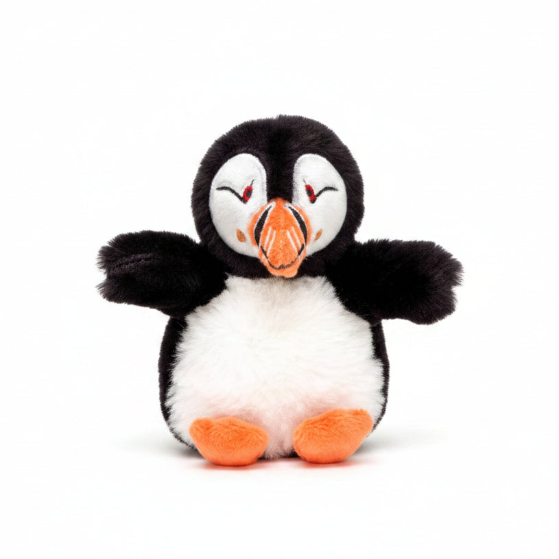 Mini puffin soft toy with orange beak and feet on white background