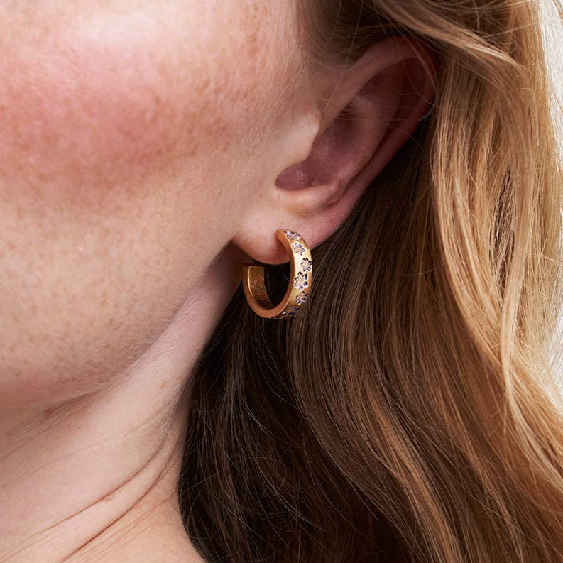 Model wearing Nightshade gold hoop earring - lifestyle close-up