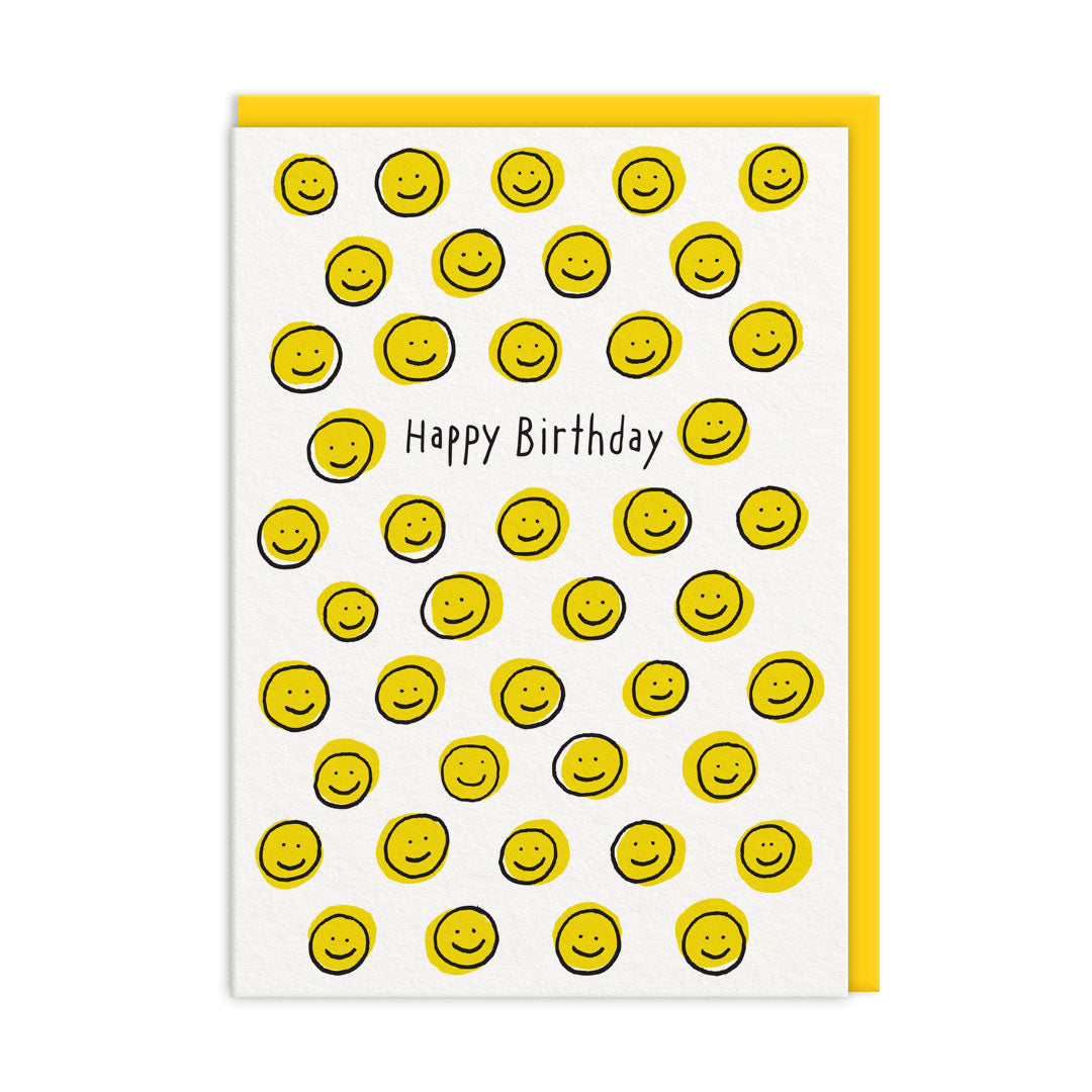 White birthday card covered in small hand-drawn yellow smiley faces