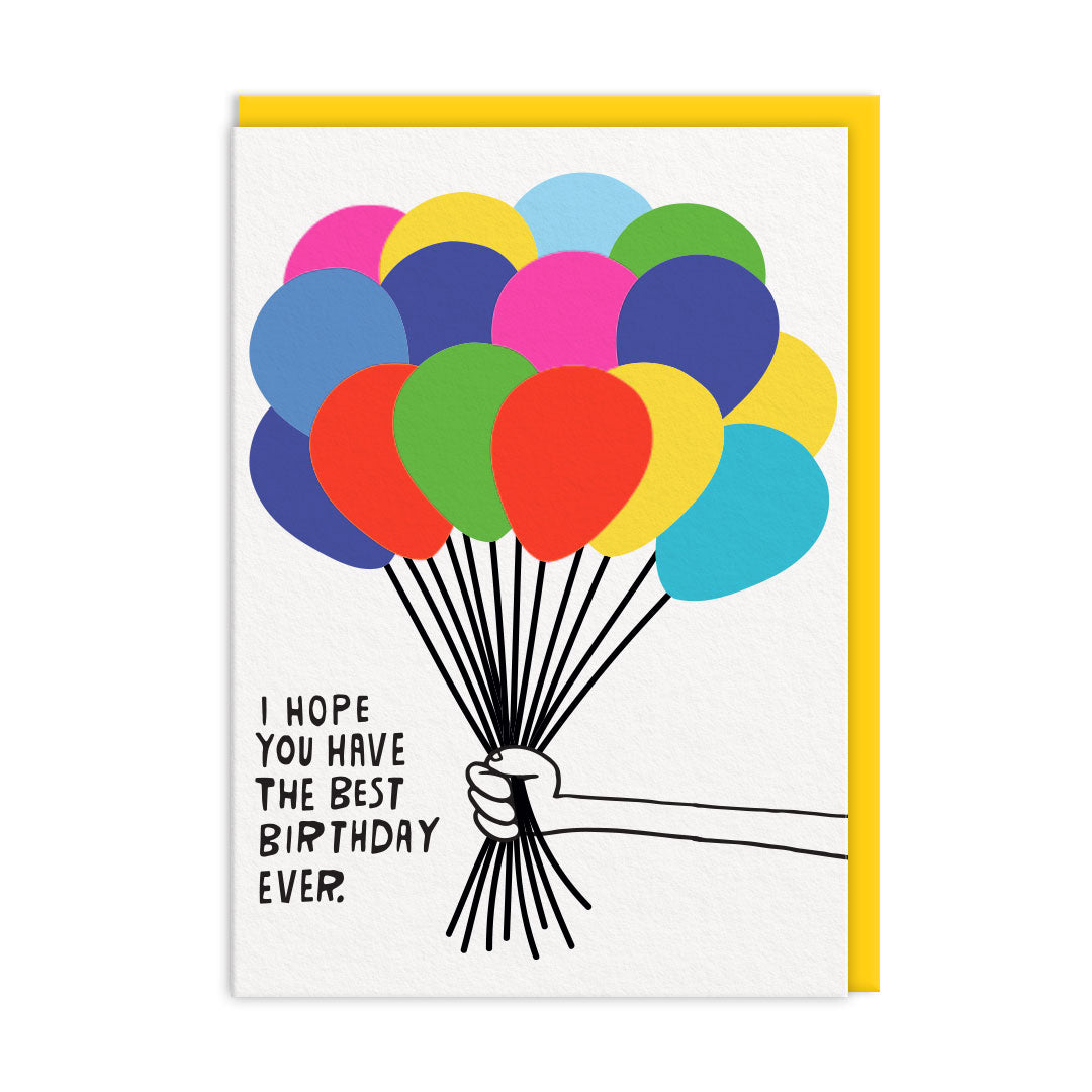 White birthday card with hand holding a large bunch of colourful balloons