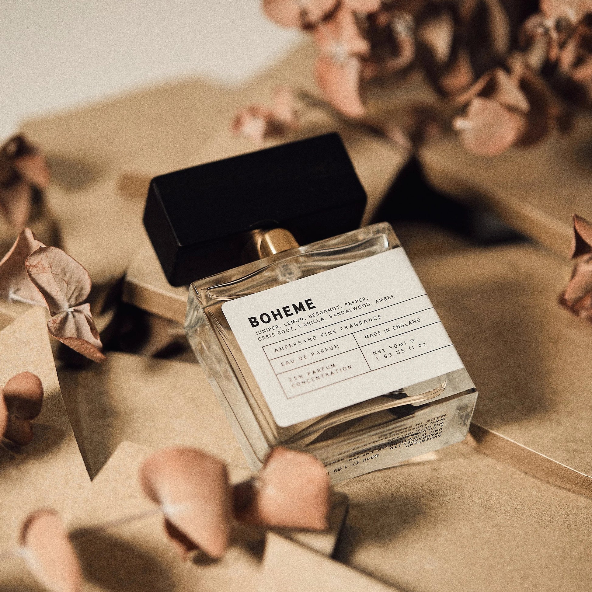 Boheme perfume styled with botanicals on textured background