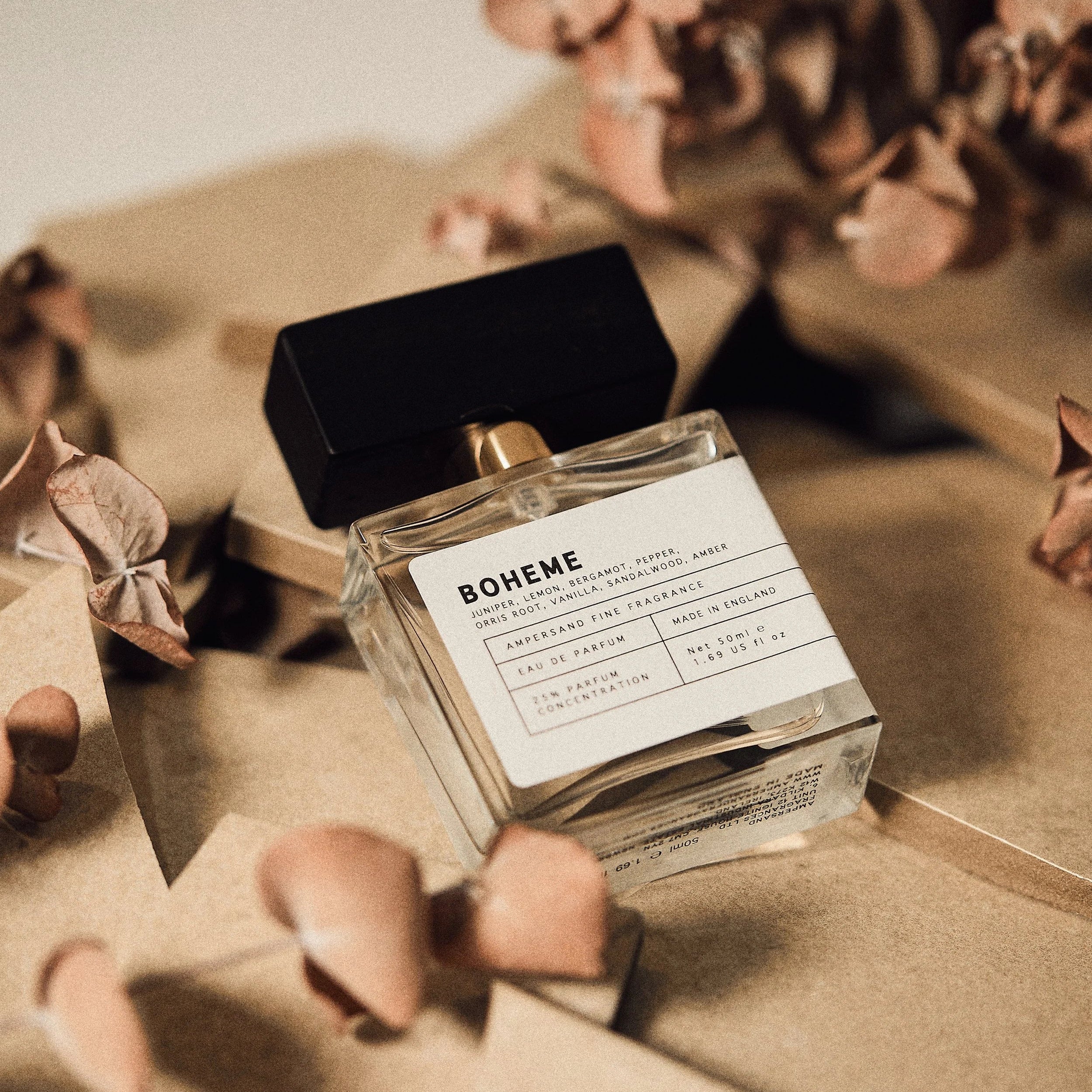 Boheme perfume styled with botanicals on textured background