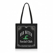 Front view of black Bad Witch Social Club tote bag with witch hat graphic.