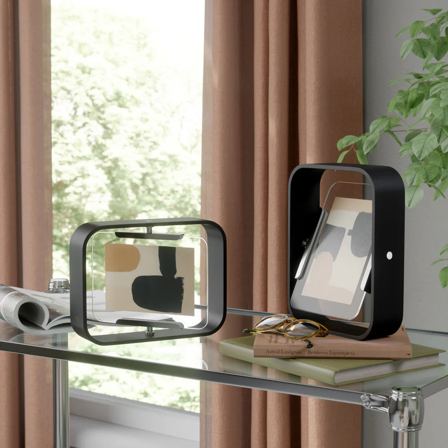 Umbra Bellwood desk frame in black finish displaying photo on white surface