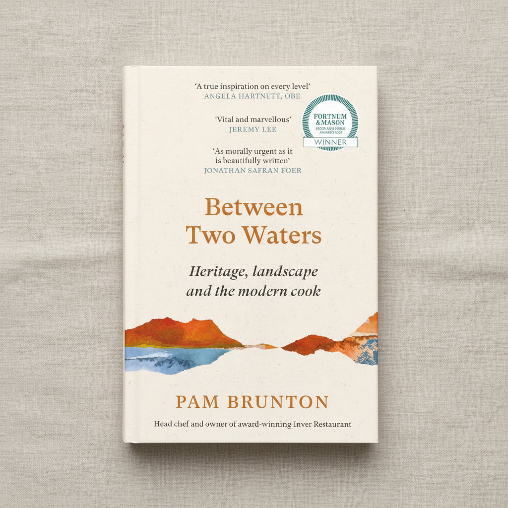 Between Two Waters paperback book cover showing heritage landscape