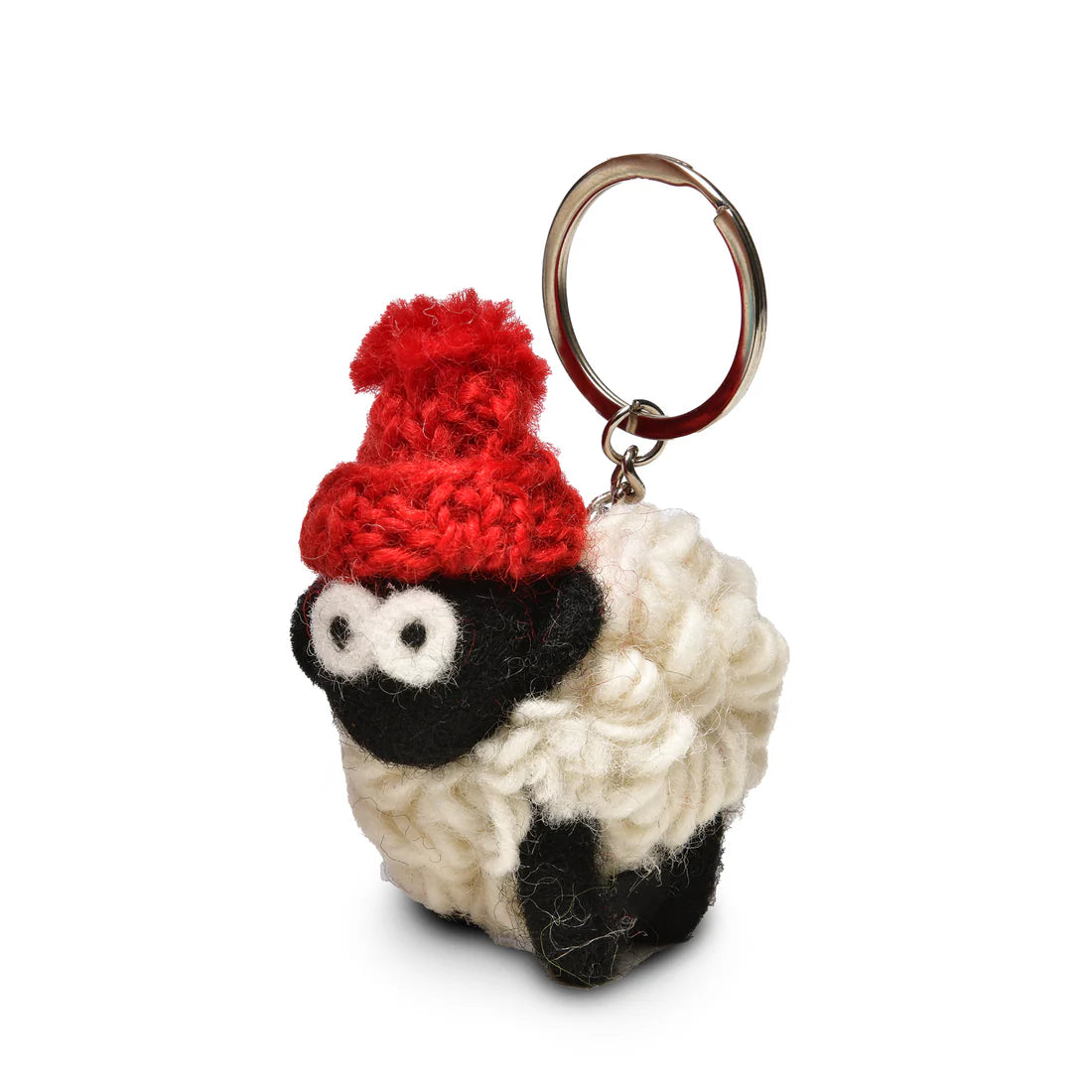 Close-up of a red-hatted knitted sheep keyring made from wool.