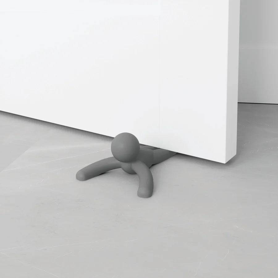 Buddy doorstop charcoal figurine showing playful pose from above