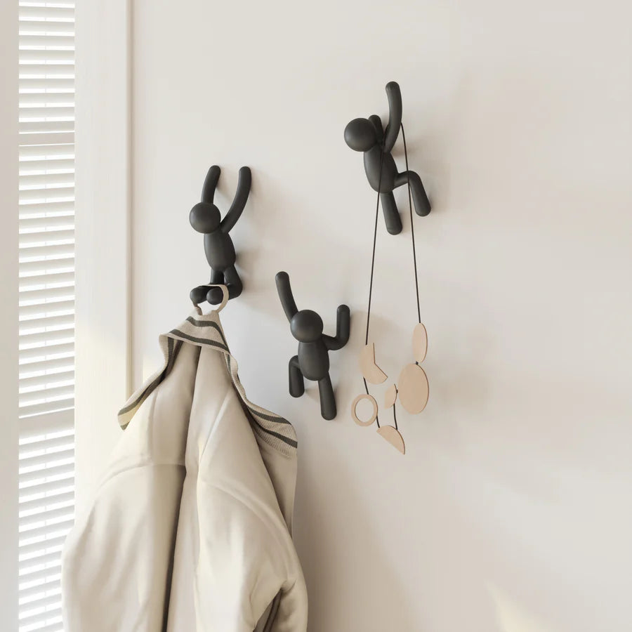Umbra Buddy wall hooks set of three in black mounted with accessories