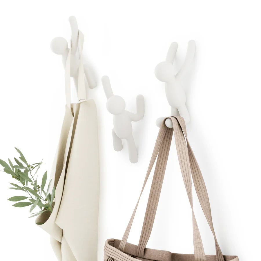 Buddy wall hooks white showing three figurine poses on light background
