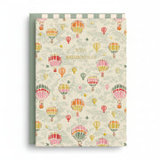 Cream card patterned with colourful hot air balloons and gold foil lettering