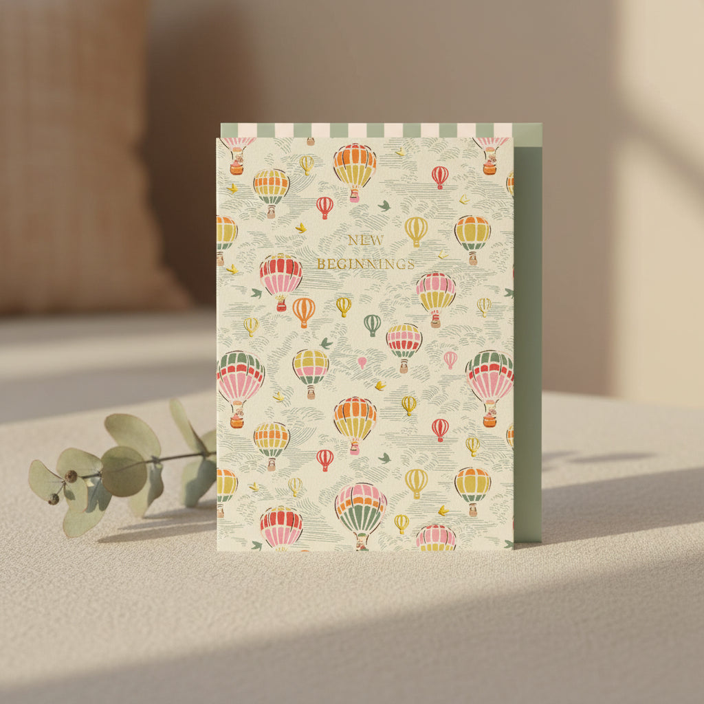 Notebook with hot air balloon pattern and 'New Beginnings' text on a white background