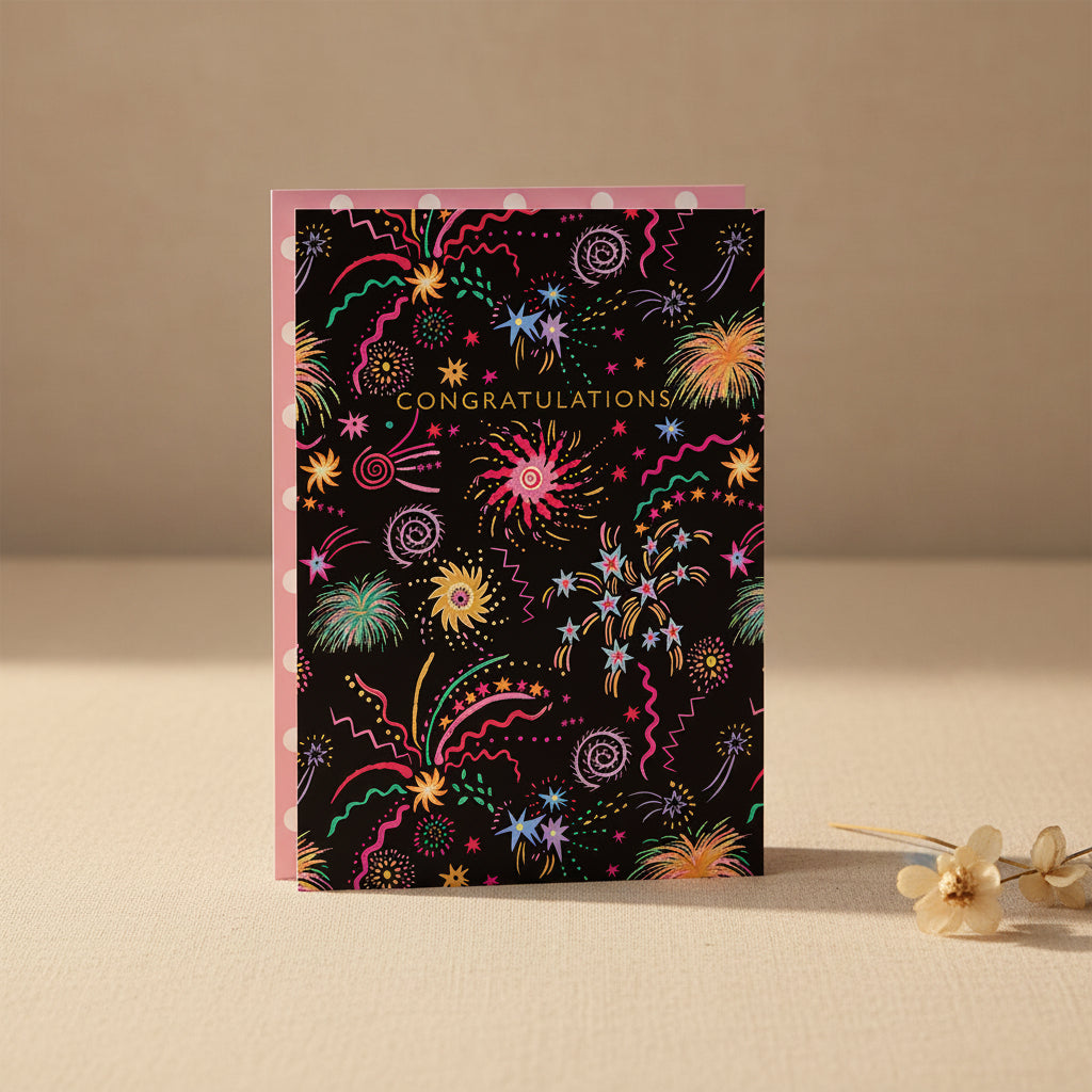 Greeting card with colorful fireworks design and 'Congratulations' text on a black background.