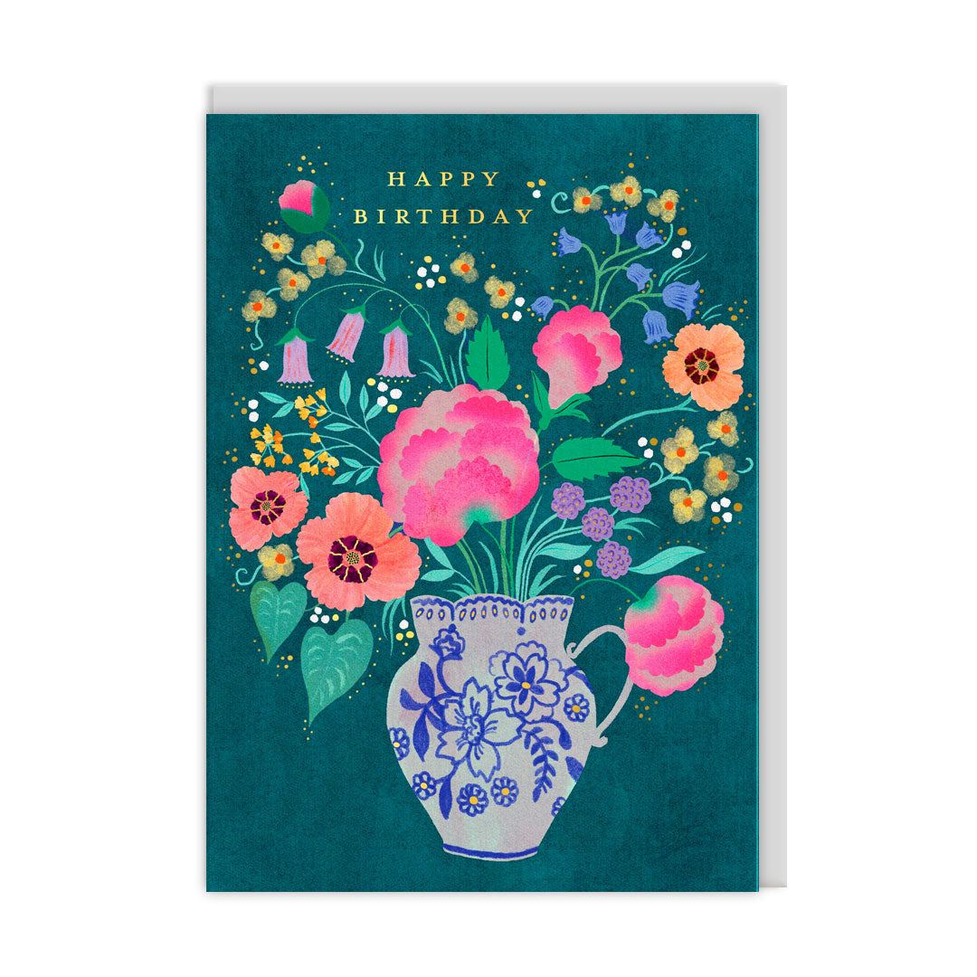 Teal birthday card with a blue and white jug full of bright flowers