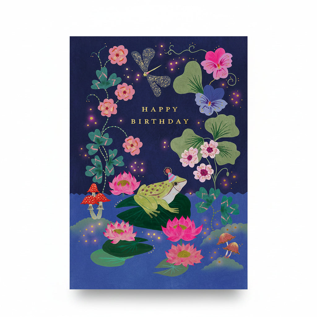Navy birthday card with a frog in a party hat on a lily pad