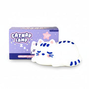 Catnap Lamp shown with packaging—soft white silicone cat lamp with blue details.
