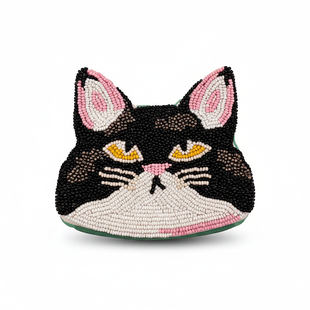 Close-up of Catnip Cat Coin Purse featuring hand-beaded black-and-white cat with pink ears.