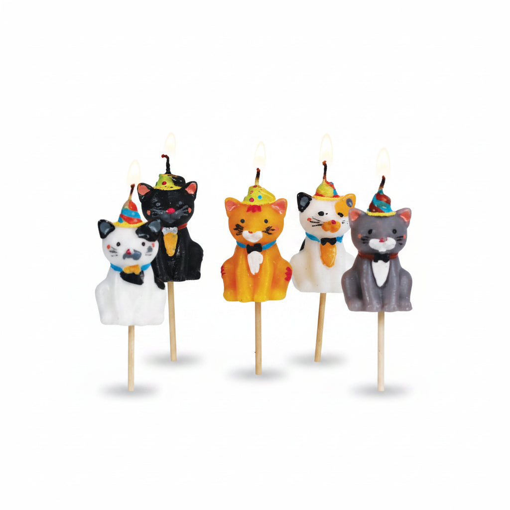 Lit Cats in Party Hats Cake Candles on a cake, showcasing a fun and playful design for a unique cake decoration.