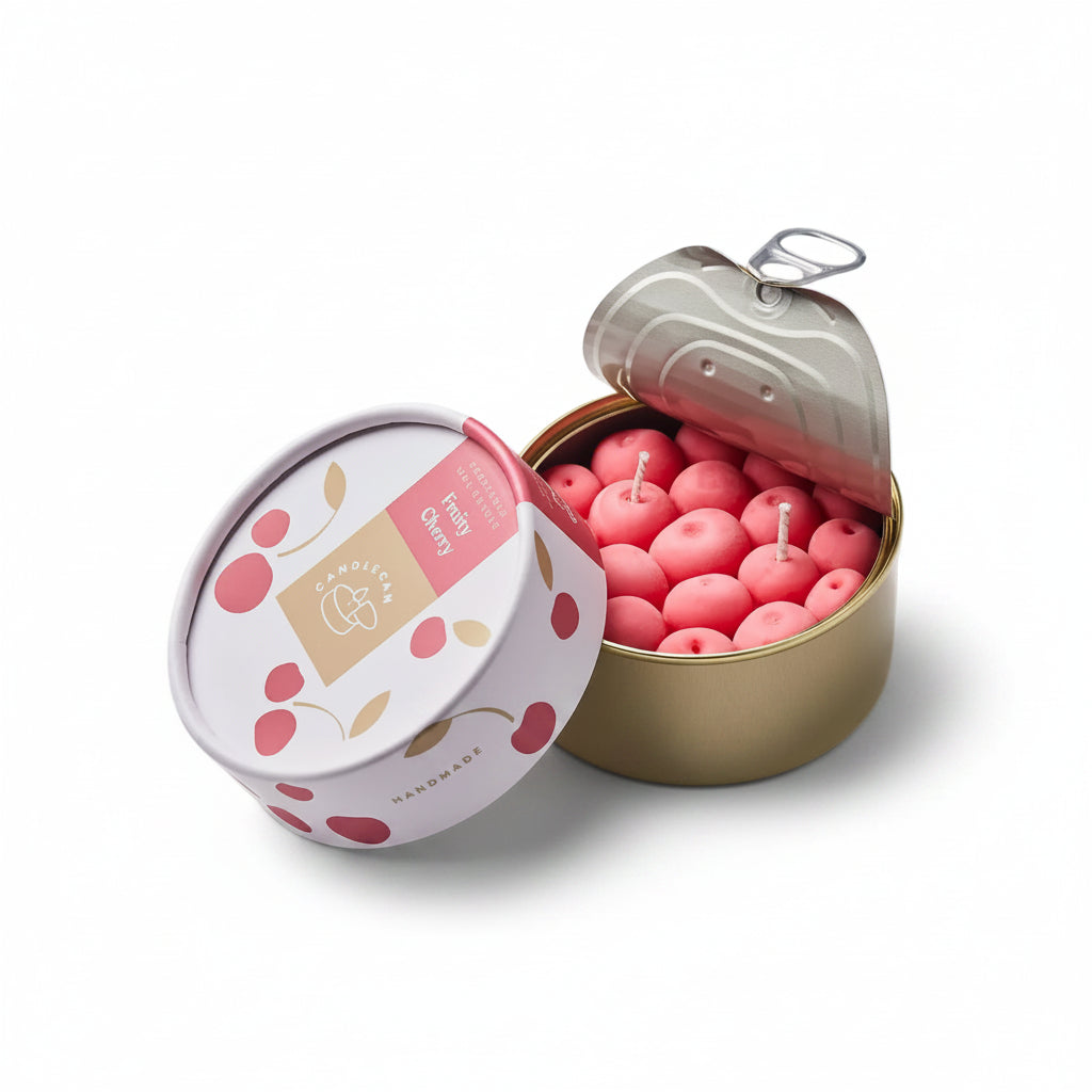 Open cherry-scented candle tin showing realistic cherry-shaped wax candles with pull-tab lid and illustrated packaging.