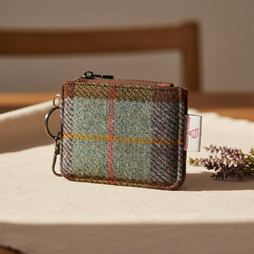 Plaid patterned coin purse with keychain on a white background
