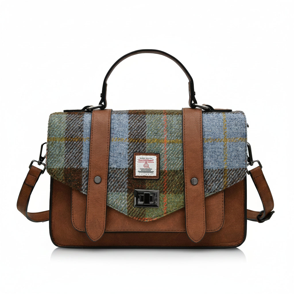 Front view of the Islander Chestnut & Blue Tartan Harris Tweed Satchel featuring classic buckle straps and Harris Tweed label.