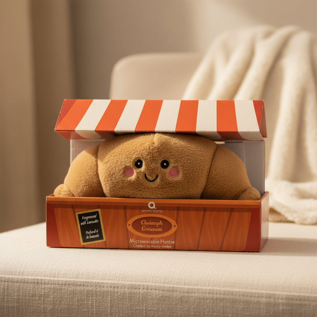 Christoph Croissant Microwavable Hottie in gift box with red and white striped lid.