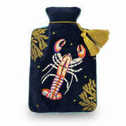 Coral Lobster Hot Water Bottle close-up – embroidered lobster with gold coral on navy velvet cover.