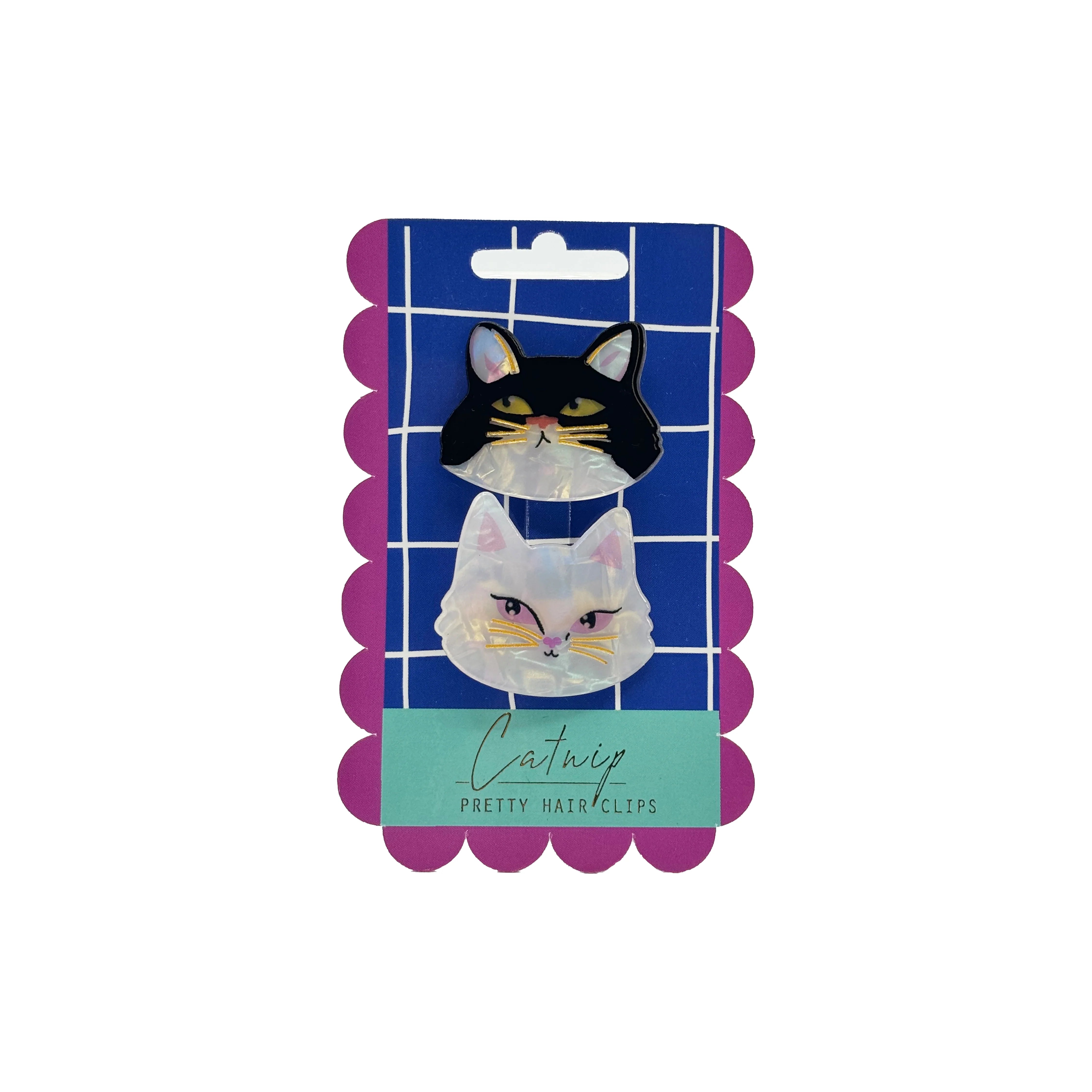Packaged Catnip Hair Clips set, featuring a white and black cat design, displayed on a vibrant blue and pink backing card.