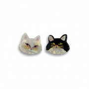 A pair of cat-shaped hair clips isolated on a white background, showing off their acrylic material and detailed design.