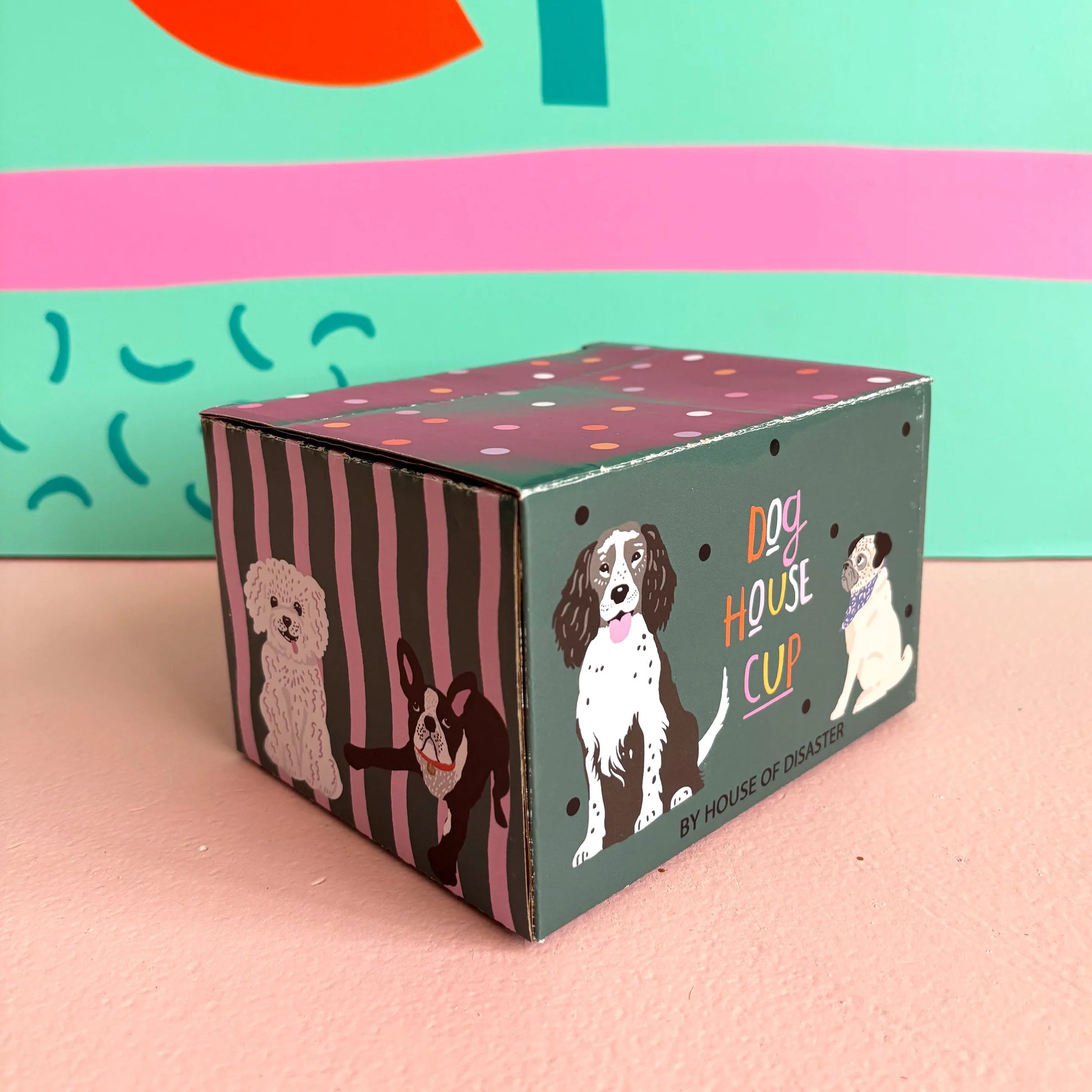 Close-up of gift box with playful dog illustrations.