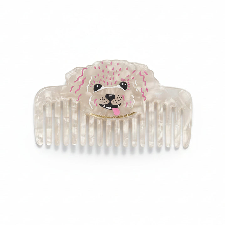 Product shot of pearlescent comb with dog face design – Dog House Hair of the Dog Comb front view.