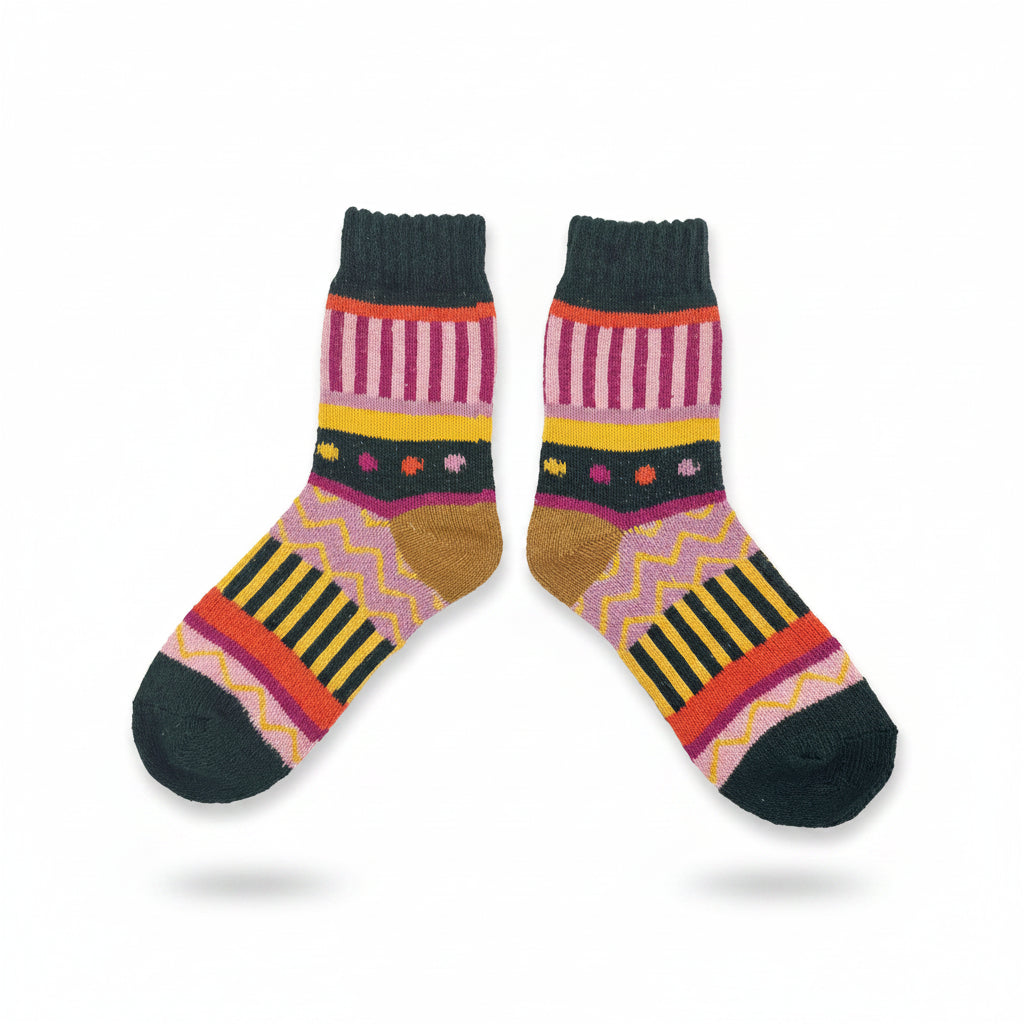Flat lay of socks with vibrant mix of stripes and polka dots.