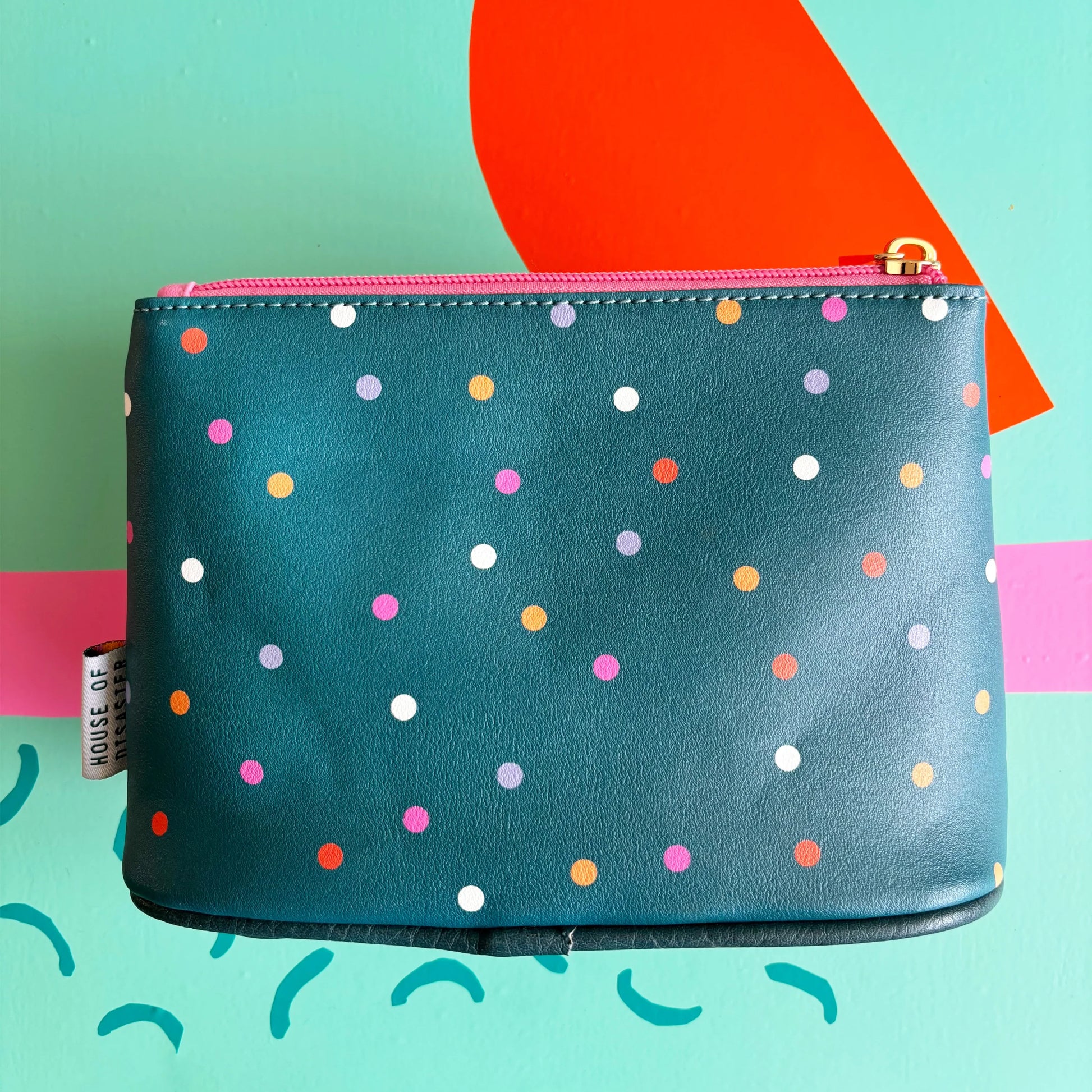 Back view of teal polka dot Dogs Bollocks Makeup Bag.