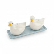 Side angle of duck salt and pepper shakers showing fine detail on wings and beak with glossy white finish.