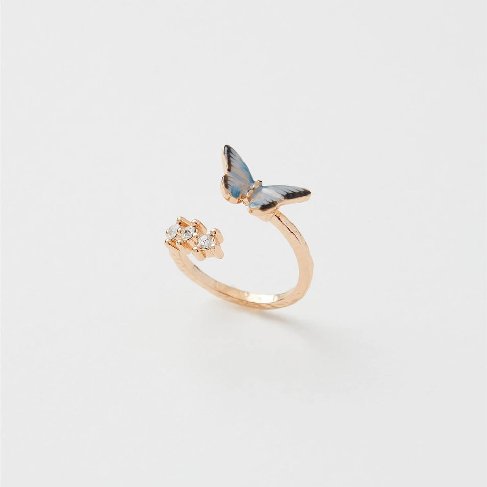 Gold adjustable Enamel Blue Butterfly Ring showing hand-painted butterfly and sparkling stones on white background.