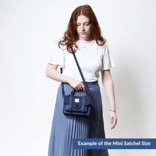 Example of a lady wearing the mini Harris Tweed satchel.