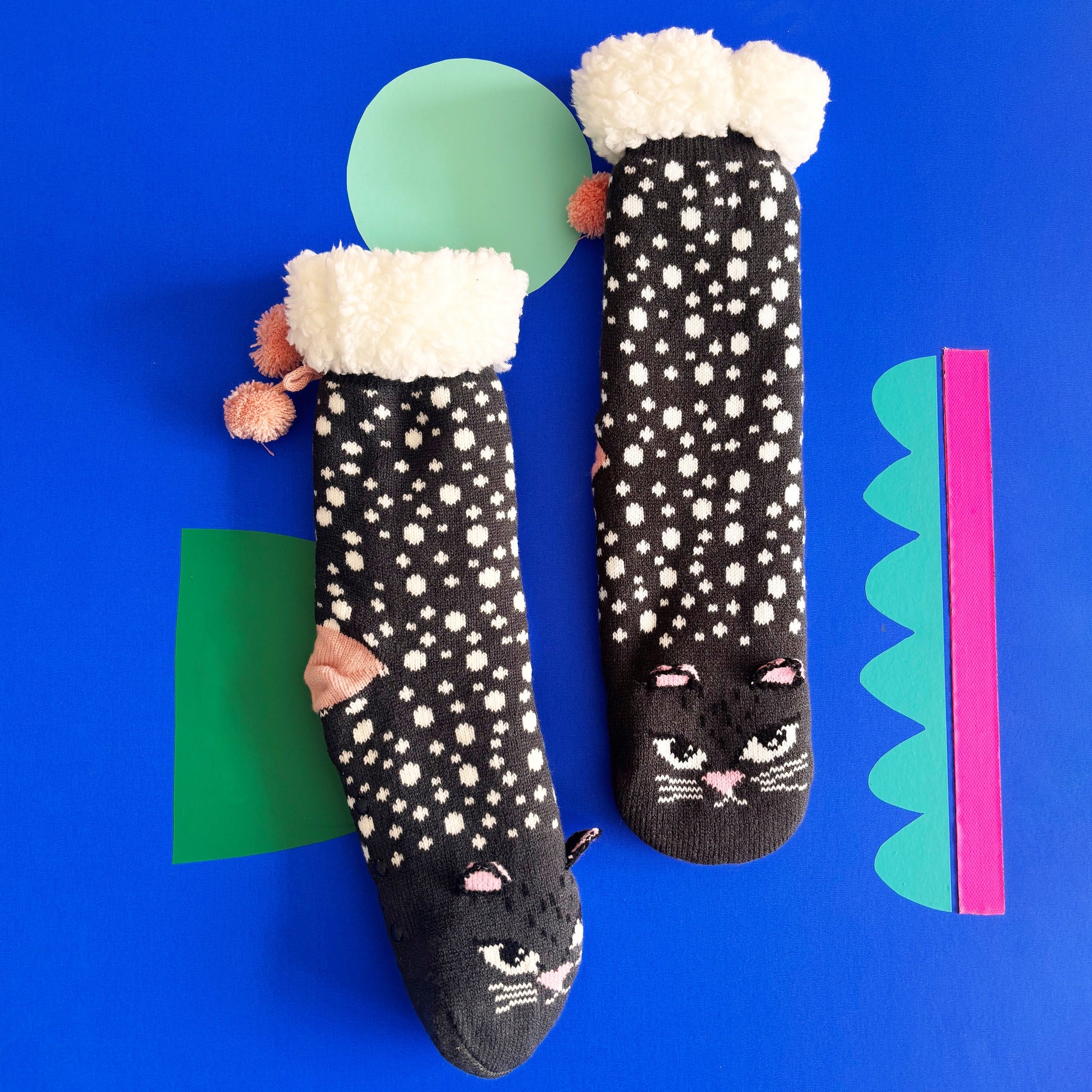 Close-up of socks showing non-slip grips and 3D ears.