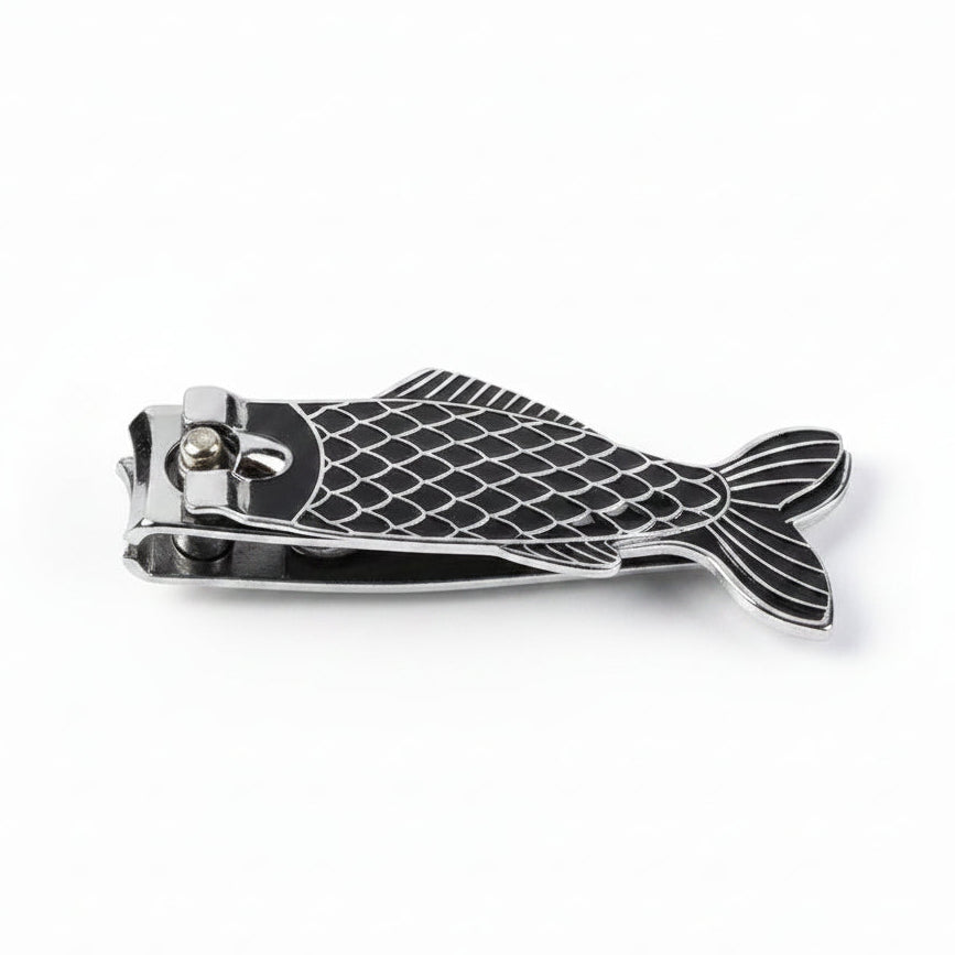 Black and silver fish shaped nail clippers close-up.